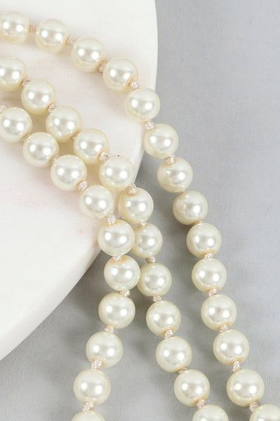 Pearl necklaces. Cream and white. 60"