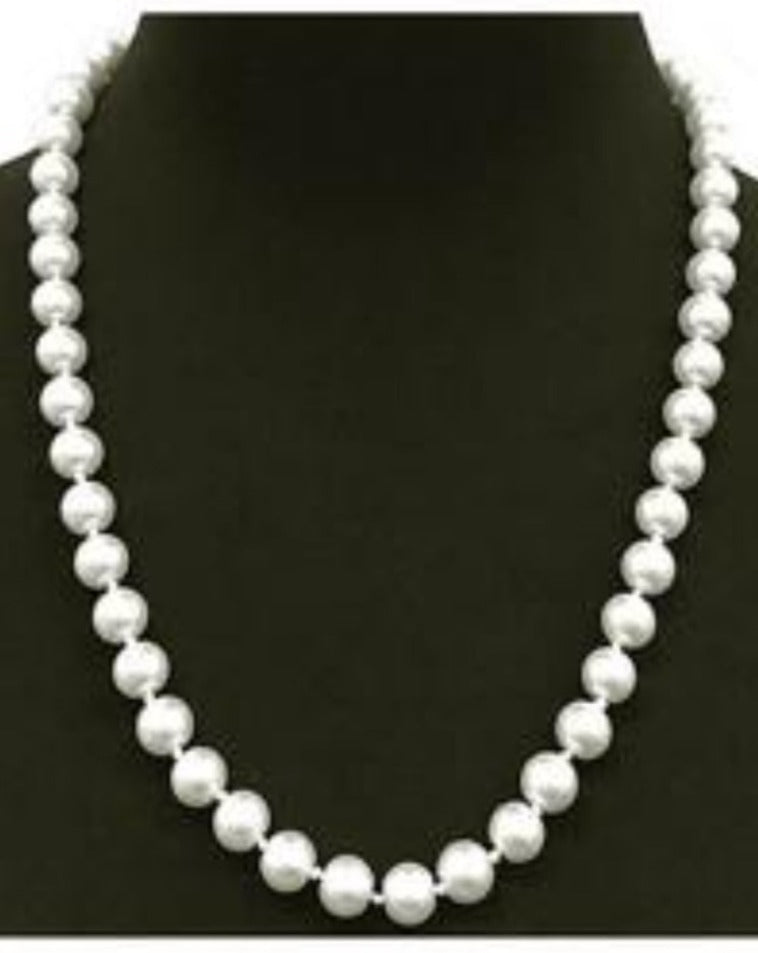 Cream and white pearls necklace.  18"