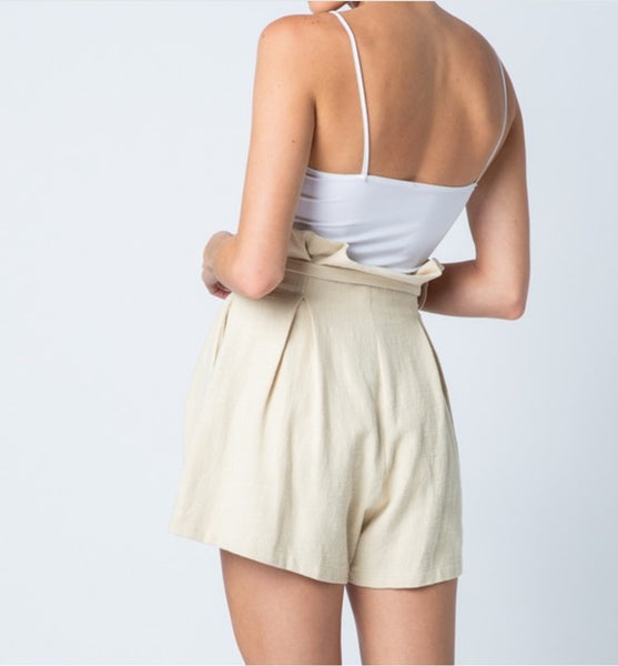 Natural pleated shorts.