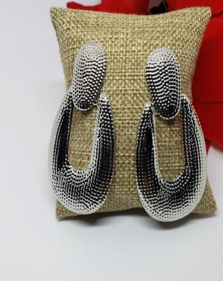 Silver statement earrings.